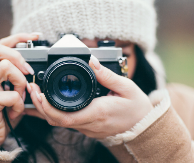 Student holding camera